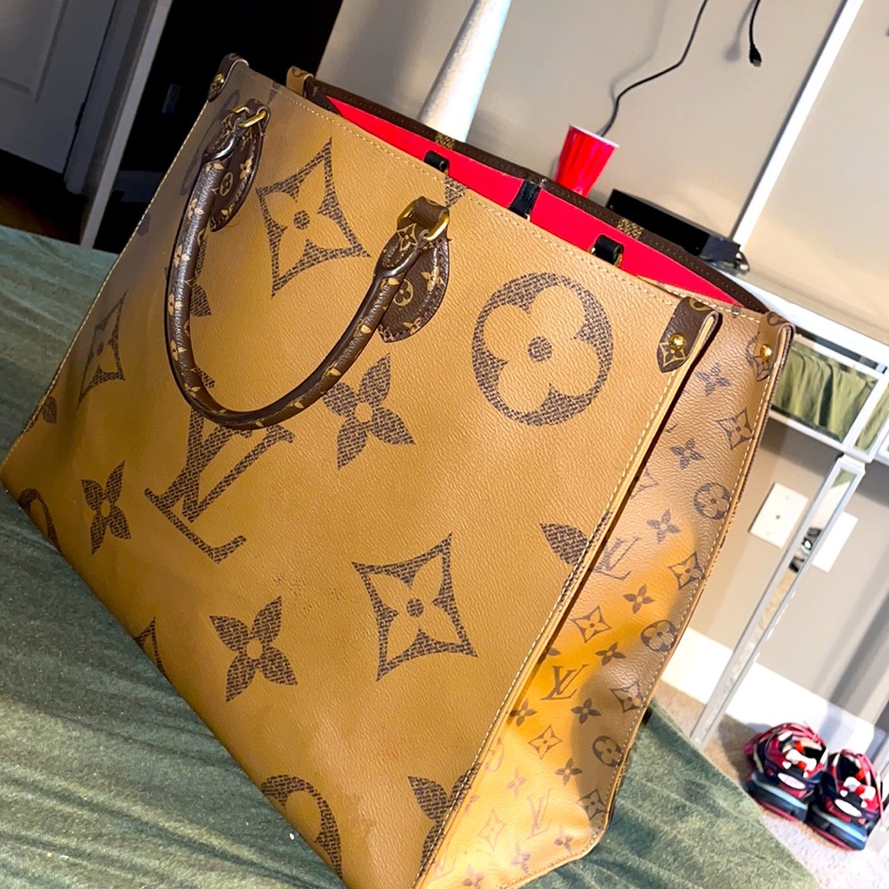 HUGE brown Louis Vuitton bag ... you can wear this bag on both sides ...
